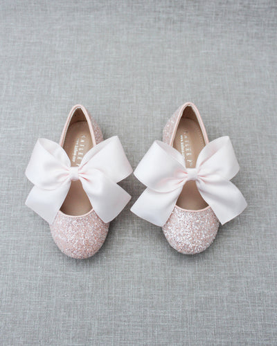 Pink glitter flats with bow