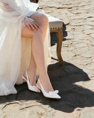 Ivory satin pointy toe slingback wedding pumps with Front Satin Bow embellishment