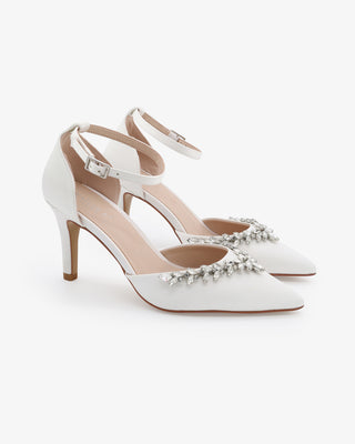 White satin wedding heels with pointed closed toe and starlet rhinestone embellishment, perfect for bridal or formal occasions