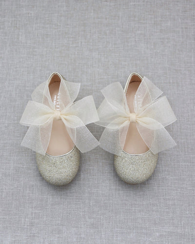 Gold glitter shoes with bow