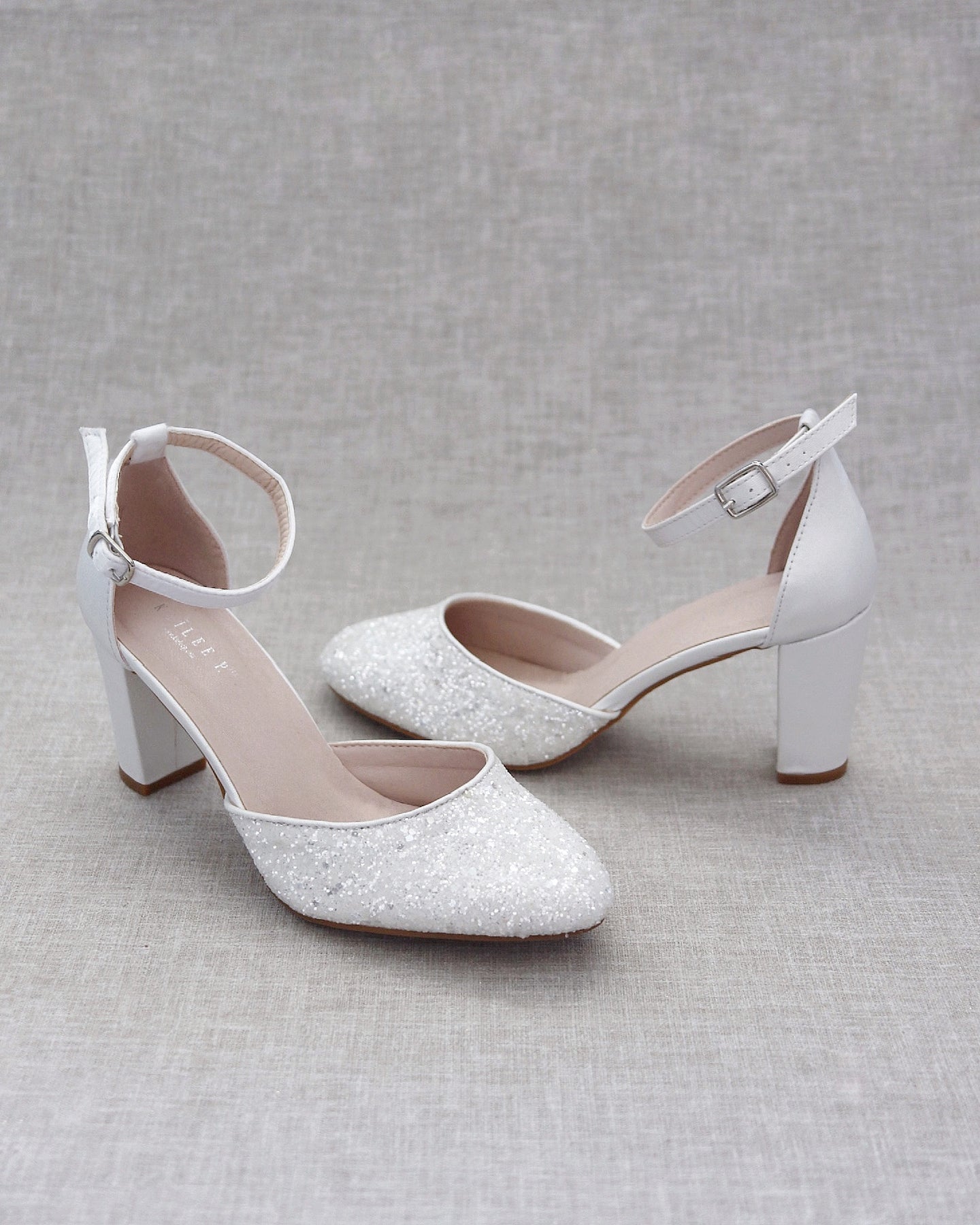 Pair of gray pointed-toe platform pumps with silver studs, Court