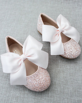 Pink glitter shoes with bow