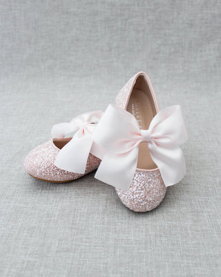 Pink glitter shoes with bow