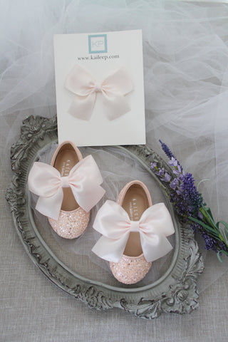 Pink glitter shoes with bow